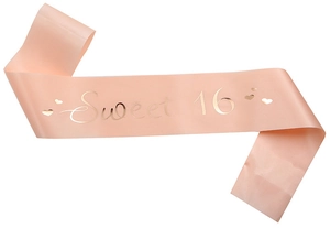 Detail of peach pink satin Sweet 16 sash with shimmering gold foil lettering