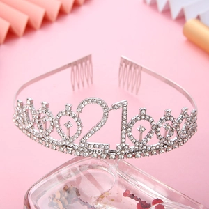 Detailed view of silver 21st birthday tiara with sparkling rhinestones and hair combs