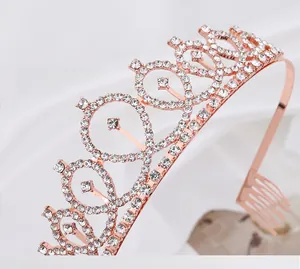 Close-up of rose gold birthday tiara with brilliant rhinestones and secure hair combs