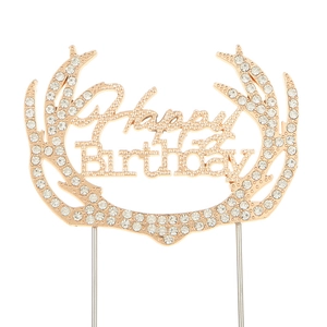 Detailed view of Happy Birthday gold metal cake topper with sparkling rhinestones and antlers