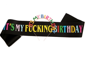 Close-up of black satin sash and metal headband with colorful It's My Birthday letters