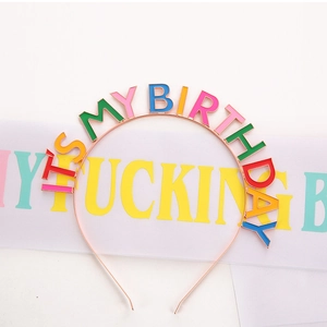 Close-up of rose gold birthday headband with colorful enamel letters and sash