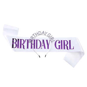 Close-up of birthday girl sash and headband set featuring purple glitter lettering