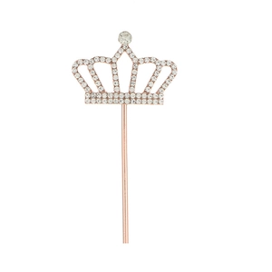 Elegant rose gold metal crown cake topper with sparkling white crystals for birthday party