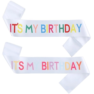 Detail of two white satin birthday sashes with colorful It's My Birthday rainbow text