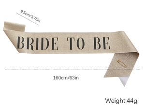 Detail of glitter champagne gold Bride To Be sash with safety pin and size dimensions
