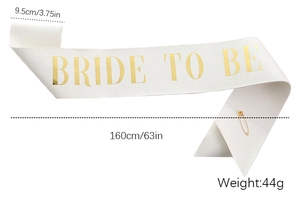 Glittery white Bride to Be sash with gold foil lettering and safety pin detail