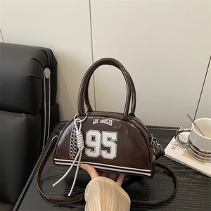 Brown semi-circular shoulder bag with white Los Angeles 95 varsity print and silver chain