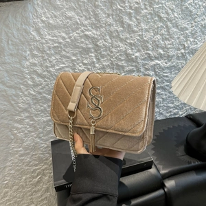 Champagne velvet crossbody bag with V-quilt pattern, gold chain strap and metal tassels