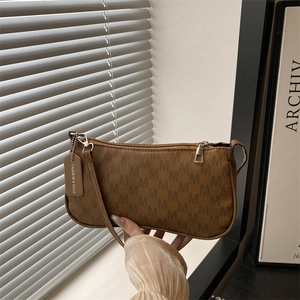 Brown monogram printed underarm bag with single strap and fashion leather tag