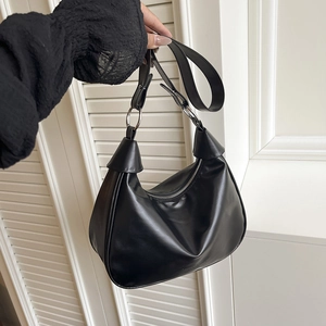 Chic black PU leather half-moon hobo bag with adjustable strap and silver metal rings