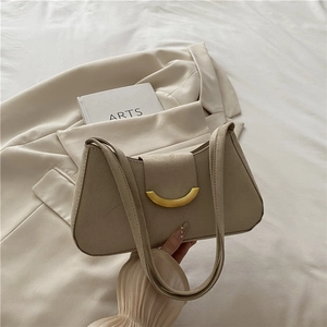 Elegant beige suede shoulder bag with gold crescent buckle for women in autumn style