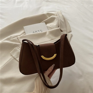 Brown suede underarm bag with gold crescent buckle and dual straps for women