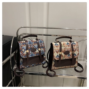 Close-up of retro jacquard fabric with geometric patterns and golden metal buckle details