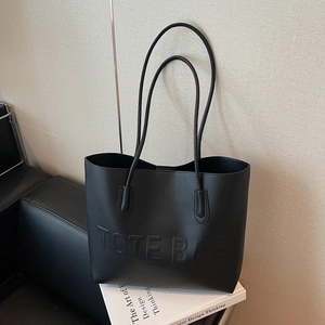 Chic black matte leather tote bag with embossed letters for women's daily commute