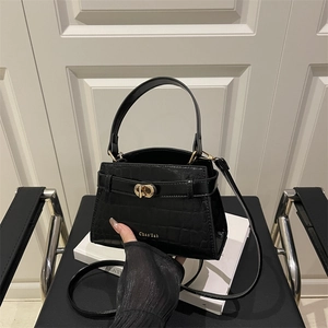 Classic black crocodile pattern handbag with gold clasp lock and shoulder strap