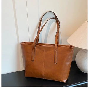 Close-up of the vintage brown tote bag with premium synthetic leather and fine stitching