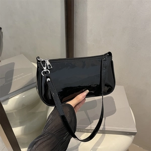 Glossy black patent leather baguette shoulder bag with minimalist silver metal buckle