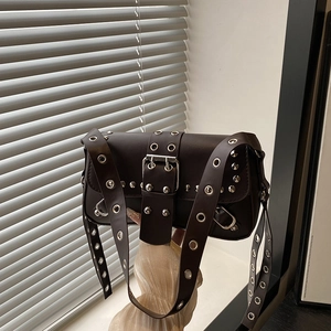 Chic dark brown punk Y2K shoulder bag with silver eyelets and metal rivets on wide strap