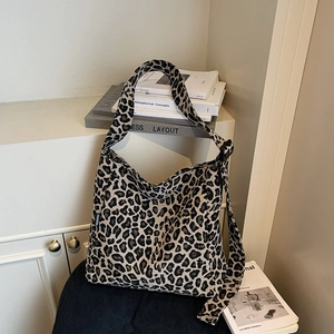 Large leopard print canvas shoulder bag with vintage slouchy design and wide strap