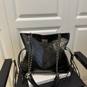 Quilted faux suede tote bag with golden chain strap and rhombus stitching patterns