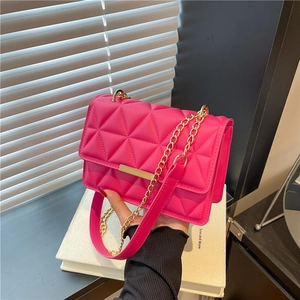 Elegant rose red quilted crossbody bag with gold chain strap and metallic bar accent