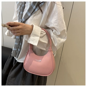 Detail of pink half-moon shoulder bag featuring white Fashion & Bags Leather lettering