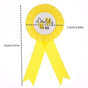 Detailed size view of yellow Daddy To Be tinplate rosette badge for baby shower parties