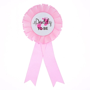 Pink Daddy To Be rosette badge with baby footprints for baby shower party celebrations