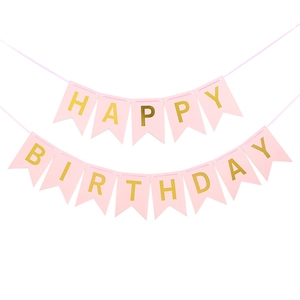 Close-up of pink swallowtail birthday banner with gold Happy Birthday lettering detail