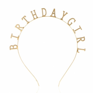 Close-up of a gold Birthday Girl metal headband for party celebrations in minimalist style
