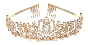 Detailed macro view of vintage golden alloy tiara with rhinestones and floral vine patterns