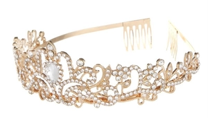 Detail of a golden alloy crystal crown with vine patterns and drop-shaped centerpiece