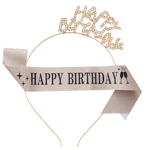 Close-up of Happy Birthday gold glitter sash and rhinestone metal headband set