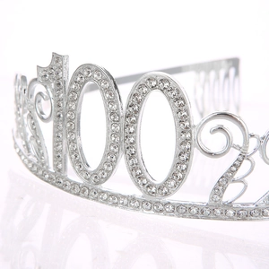 Macro view of silver crystal tiara with 100 number design and sparkling rhinestones