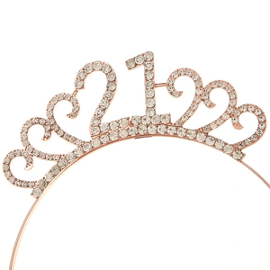 Detail of rose gold 21st birthday crown with crystal rhinestones and heart pattern