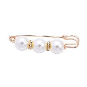 Elegant gold safety pin brooch with white pearls and sparkling crystal accents on white background
