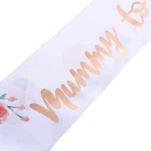 White Mummy to Be sash with rose gold foil lettering and floral patterns for party