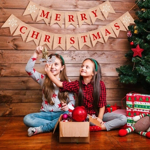 Rustic Merry Christmas burlap banner with red lettering and white snowflake details