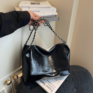 Vintage black faux leather tote bag with silver chain strap and large capacity design