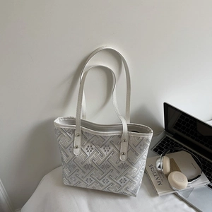 Modern plaid tote bag with floral jacquard and white leather straps for daily commute