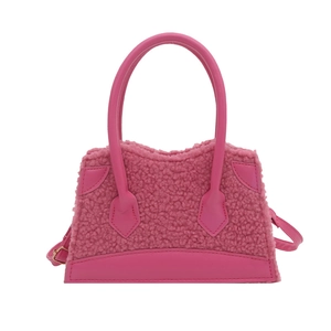 Pink lamb wool tote bag with trapezoid structure and faux leather handle for winter