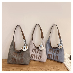 Three canvas tote bags in grey and denim blue with leather straps and puppy charms