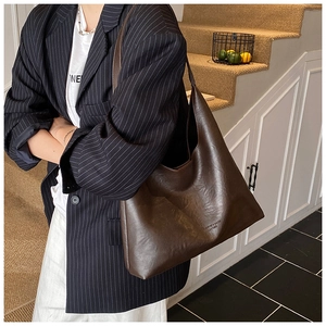 Retro deep brown faux leather hobo bag with large capacity shown in street style