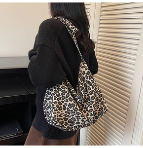Detail view of large leopard print hobo bag showing natural drape and spacious canvas fabric