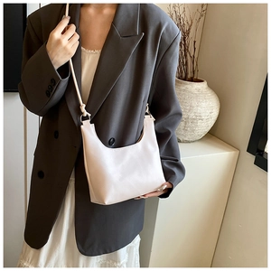 Minimalist cream white crescent hobo bag in lychee pattern leather for women