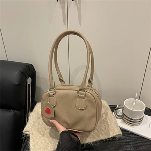 Minimalist khaki litchi grain leather Boston handbag for women with a red heart charm