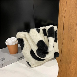 Sac à main chic en fausse fourrure à motif vache noir et blanc pour femmes