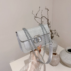 Silver sequin crossbody bag with chain strap and round metallic buckle lock
