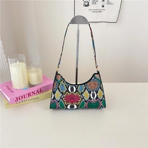 Fashionable women's shoulder bag with vibrant colorful snakeskin pattern and zipper closure